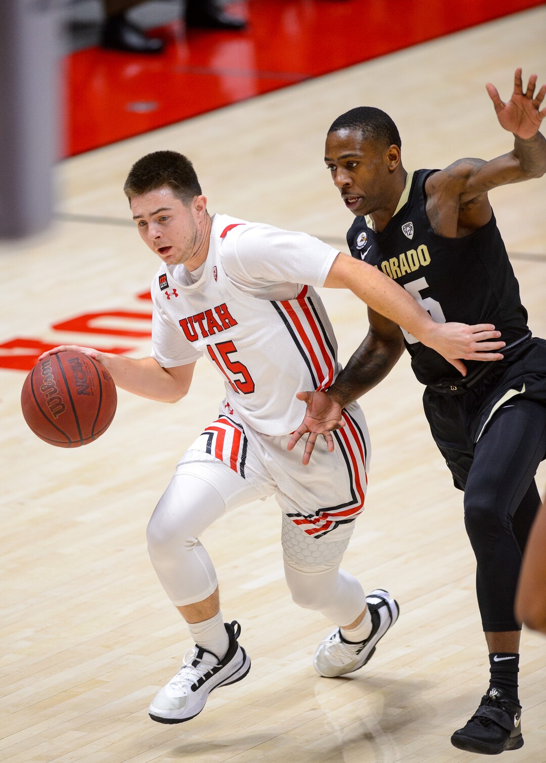 (Trent Nelson  |  The Salt Lake Tribune) Utah Utes guard Rylan Jones (15) defended by Colorado Buffaloes guard McKinley Wright IV (25) as Utah hosts Colorado, NCAA basketball in Salt Lake City on Monday, Jan. 11, 2021.