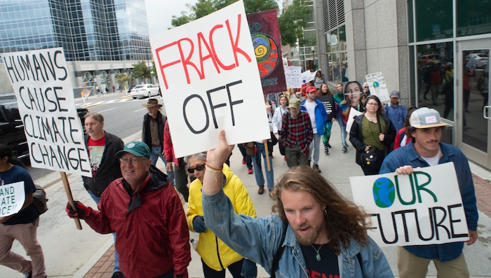 (Rick Egan  |  The Salt Lake Tribune)      Hundreds of students from around the state chant and sing as they march up State Street to the Utah State Capitol Building, demanding action on the climate crisis. Friday, Sept. 20, 2019.