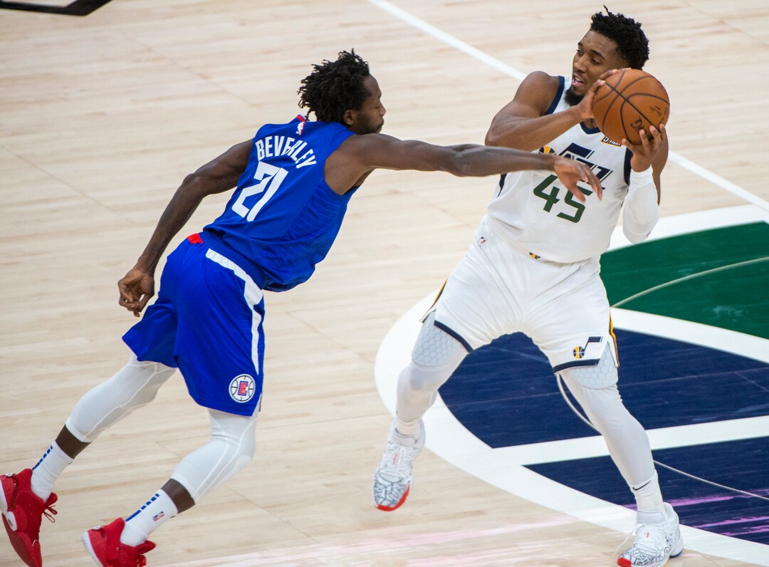 (Rick Egan | The Salt Lake Tribune) LA Clippers guard Patrick Beverley (21) goes for the ball, as Utah Jazz guard Donovan Mitchell (45) keeps control, in NBA action between the Utah Jazz and the LA Clippers at Vivint Arena, on Friday, Jan. 1, 2021.