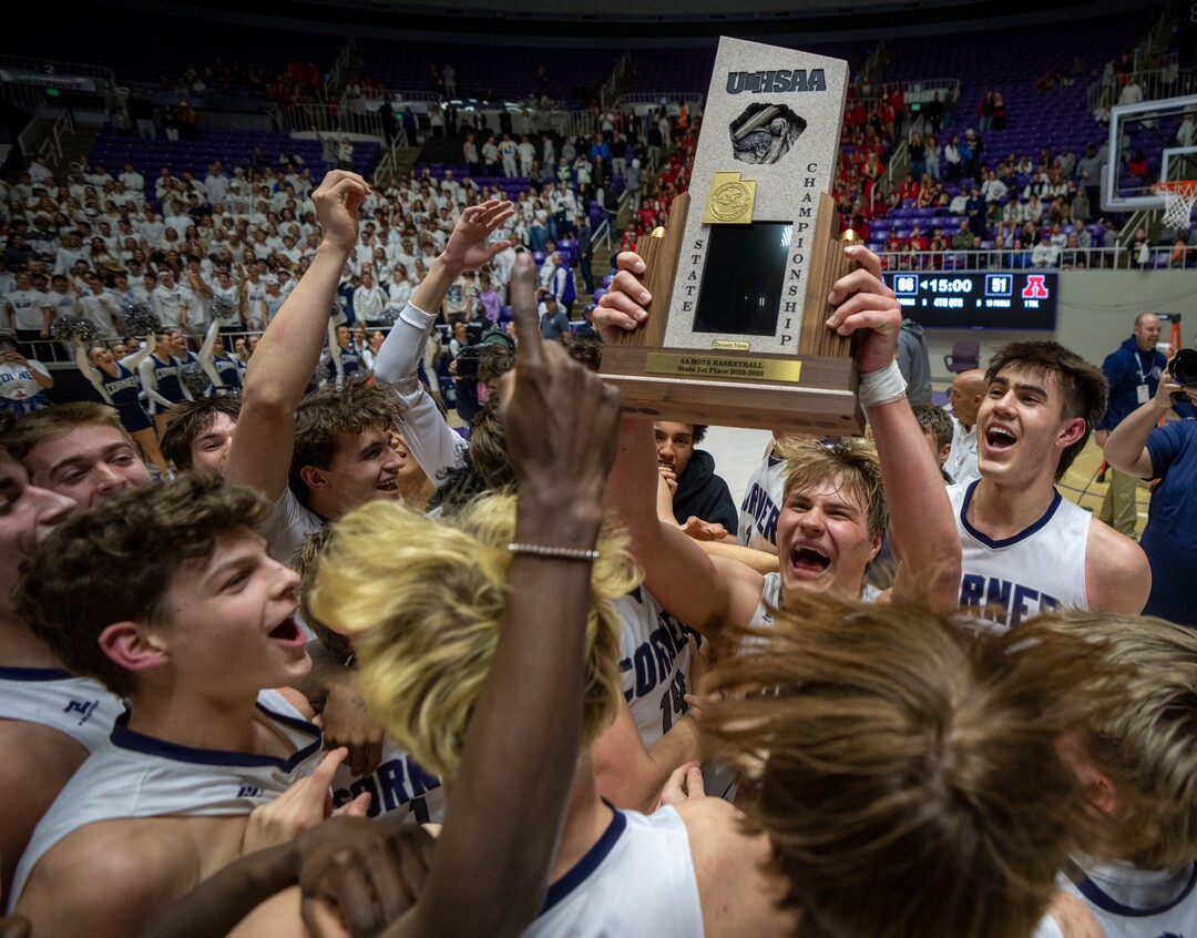 (Rick Egan | The Salt Lake Tribune) Corner Canyon celebrates thier win over the American Fork Cavemen, for  the Boys 6A State Championship at Weber State, on Saturday, March 4, 2023.