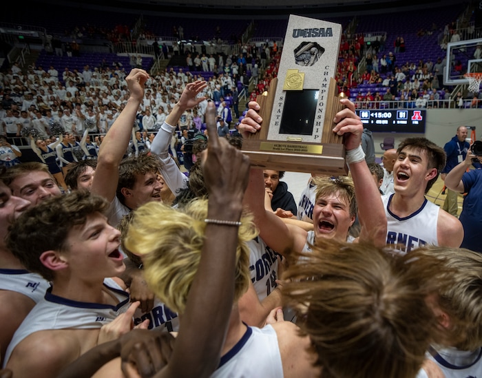 (Rick Egan | The Salt Lake Tribune) Corner Canyon celebrates thier win over the American Fork Cavemen, for  the Boys 6A State Championship at Weber State, on Saturday, March 4, 2023.