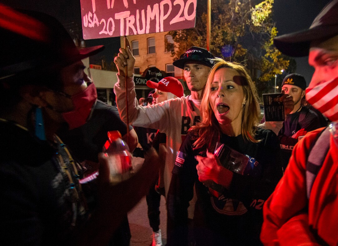 (Rick Egan  |  The Salt Lake Tribune)  Carl Moore responds to a Trump supporter and she told he and his Native American friends to  "go back home if you don't like it here", as protesters gather near the University of Utah where Mike Pence is debating Kamala Harris on Wednesday, Oct. 7, 2020.