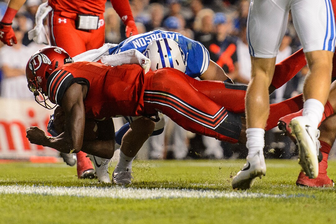 (Trent Nelson | The Salt Lake Tribune)  Utah Utes quarterback Tyler Huntley (1) dives for a touchdown as BYU hosts Utah, NCAA football in Provo, Saturday September 9, 2017.