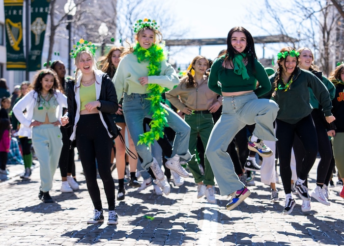 (Rick Egan | The Salt Lake Tribune) Students from Judge Memorial Catholic High School dance in the Saint Patrick's Parade at the Gateway in Salt Lake City, on Saturday, March 12, 2022.