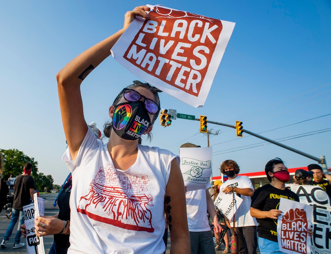 (Rick Egan  |  The Salt Lake Tribune)     Protesters dance through the neighborhood in Rose Park, during the Dance Dance for Revolution protest for racial equality, on Sunday, Aug. 23, 2020. The protest was in memory of Jovany Mercardo who was shot last August by Ogden police by four officers, hitting his body sixteen times.