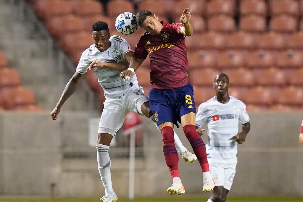 Real Salt Lake midfielder Damir Kreilach (8) and Los Angeles FC midfielder Mark-Anthony Kaye, left, vie for a head ball during the first half of an MLS soccer match Sunday, Oct. 4, 2020, in Sandy, Utah. (AP Photo/Rick Bowmer)