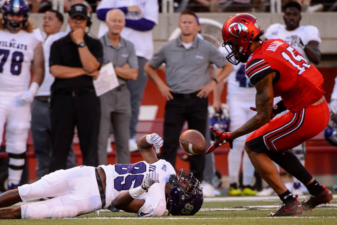 (Trent Nelson | The Salt Lake Tribune)  Weber State Wildcats wide receiver Devon Cooley (85) loses the ball as the University of Utah Utes host the Weber State Wildcats, Thursday Aug. 30, 2018 at Rice-Eccles Stadium in Salt Lake City. At right is Utah Utes defensive back Corrion Ballard (15).