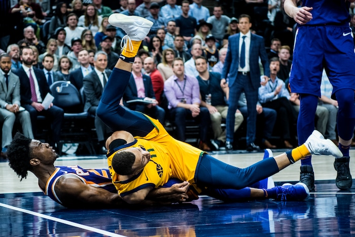 (Chris Detrick  |  The Salt Lake Tribune)  Utah Jazz guard Dante Exum (11) fouls Phoenix Suns guard Josh Jackson (20) during the game at Vivint Smart Home Arena Thursday, March 15, 2018. Utah Jazz defeated Phoenix Suns 116-88.