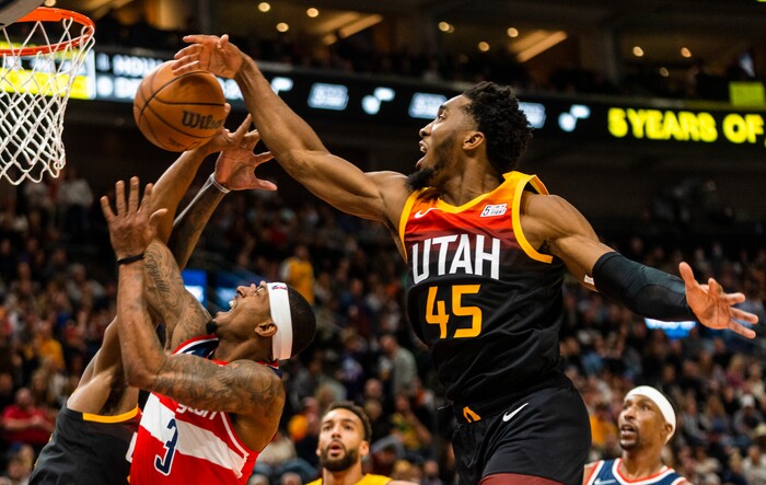 (Rick Egan | The Salt Lake Tribune) Washington Wizards guard Bradley Beal (3) takes the ball to the hoop, as Utah Jazz guard Donovan Mitchell (45) and Utah Jazz center Rudy Gobert (27) defend, in NBA action between the Utah Jazz and the Washington Wizards, at Vivint Arena on Saturday, Dec. 18, 2021.
