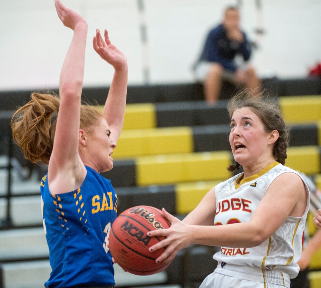 (Rick Egan  |  The Salt Lake Tribune)    San Juan forward, Delaney Palmer (34) defends as Abbey Storms (20), Judge Memorial takes the ball up the middle, in 3A Women's basketball playoff action Judge Memorial vs. San Juan, in Heber City, Friday, Feb. 16, 2018.