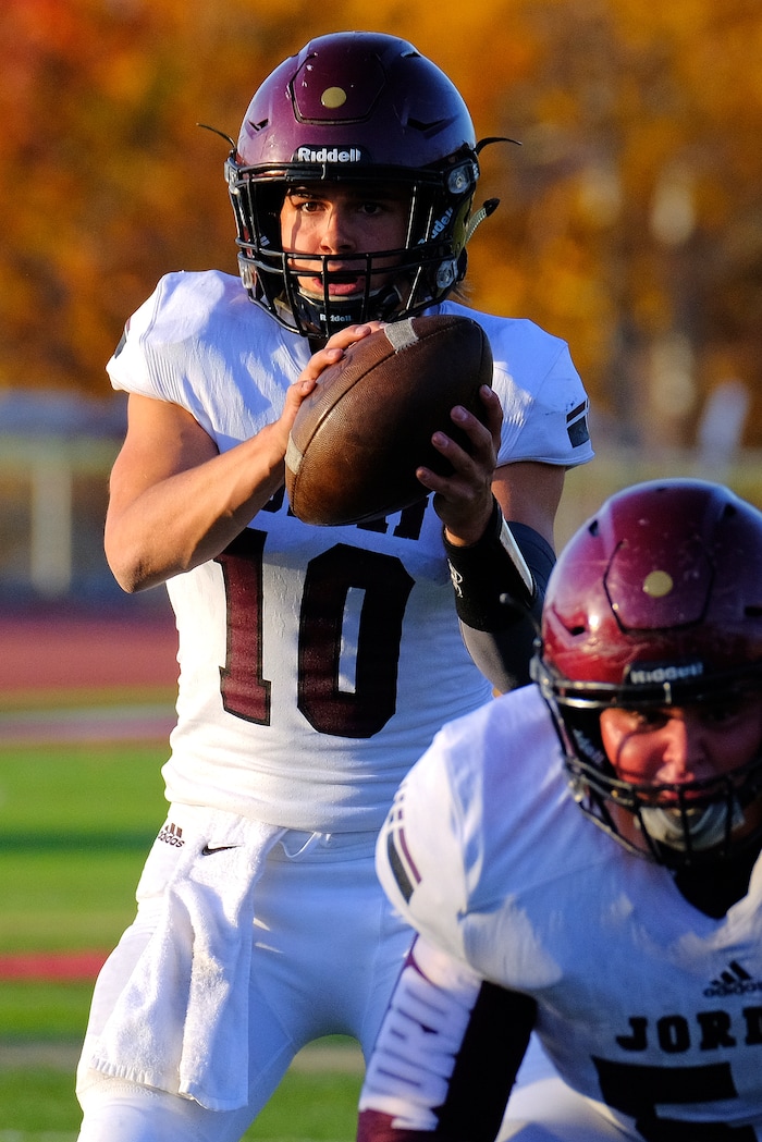 (Leah Hogsten  |  The Salt Lake Tribune) Jordan's  quarterback Crew Wakeley looks for the pass. Jordan High School boys' football team defeated Viewmont High School 28-20 during their class 5A football playoff opener, Friday, October 27, 2017 in Bountiful.