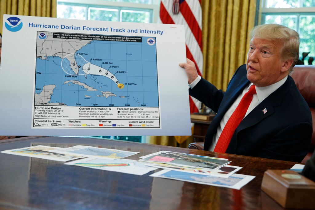 (Evan Vucci | AP file photo) President Donald Trump talks with reporters after receiving a briefing on Hurricane Dorian in the Oval Office of the White House, Wednesday, Sept. 4, 2019, in Washington.