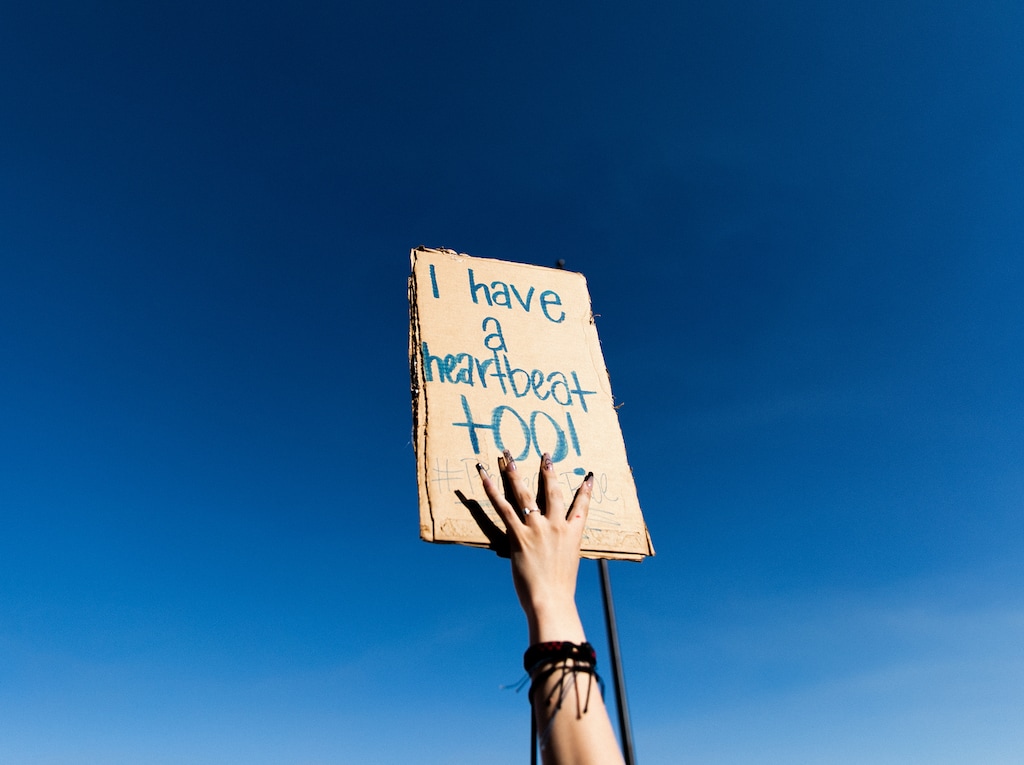 (Rachel Rydalch | Special to The Tribune) A sign reads, "I have a heartbeat too" held up by a woman in attendance at the Capitol in support of abortion rights on Sunday, June 26, 2022.