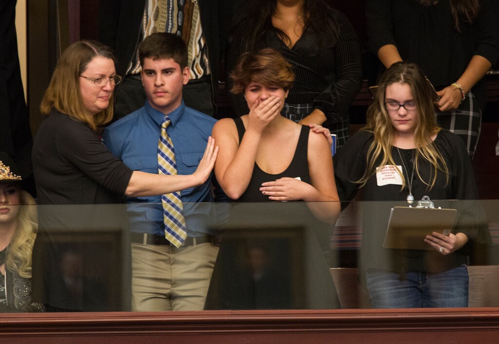 (Mark Wallheiser | The Associated Press) Sheryl Acquarola, a 16 year-old junior from Marjory Stoneman Douglas High School is overcome with emotion in the east gallery of the House of Representatives after the representatives voted not to hear the bill banning assault rifles and large capacity magazines at the Florida Capital in Tallahassee, Fla., Feb 20, 2018. Acquarola was one of the survivors of the Marjory Stoneman Douglas High School shooting that left 17 dead, who were in Tallahassee channeling their anger and sadness into action.