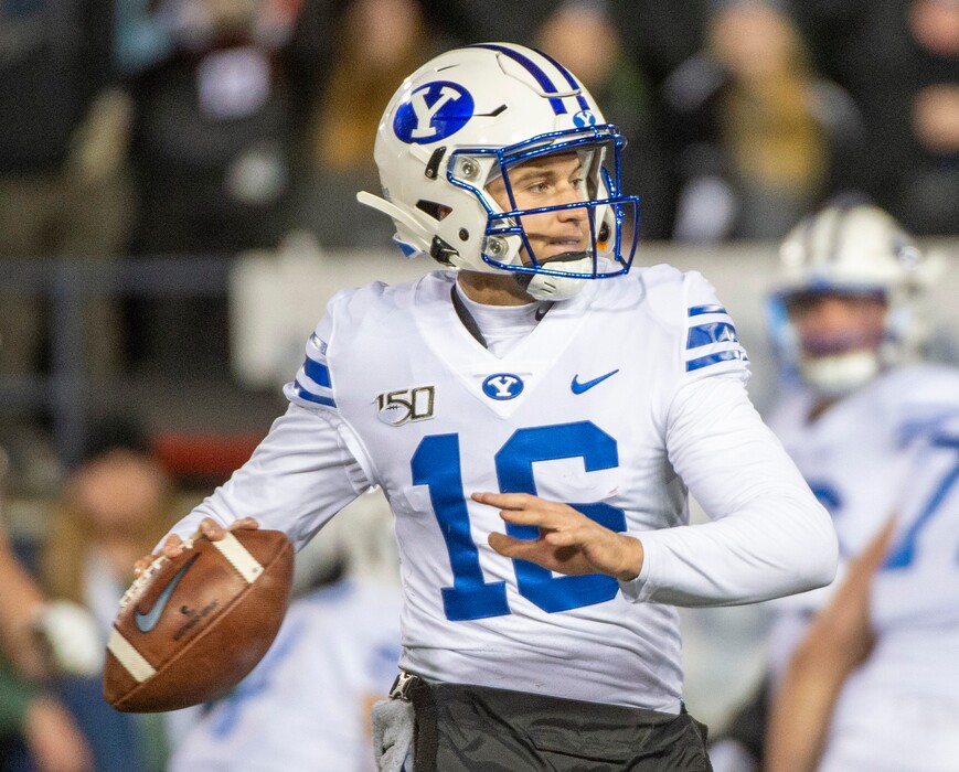 (Rick Egan  |  The Salt Lake Tribune)       Brigham Young Cougars quarterback Baylor Romney, looks down field, in football action between Brigham Young Cougars and Utah State Aggies in Logan, Saturday, Nov. 2, 2019.