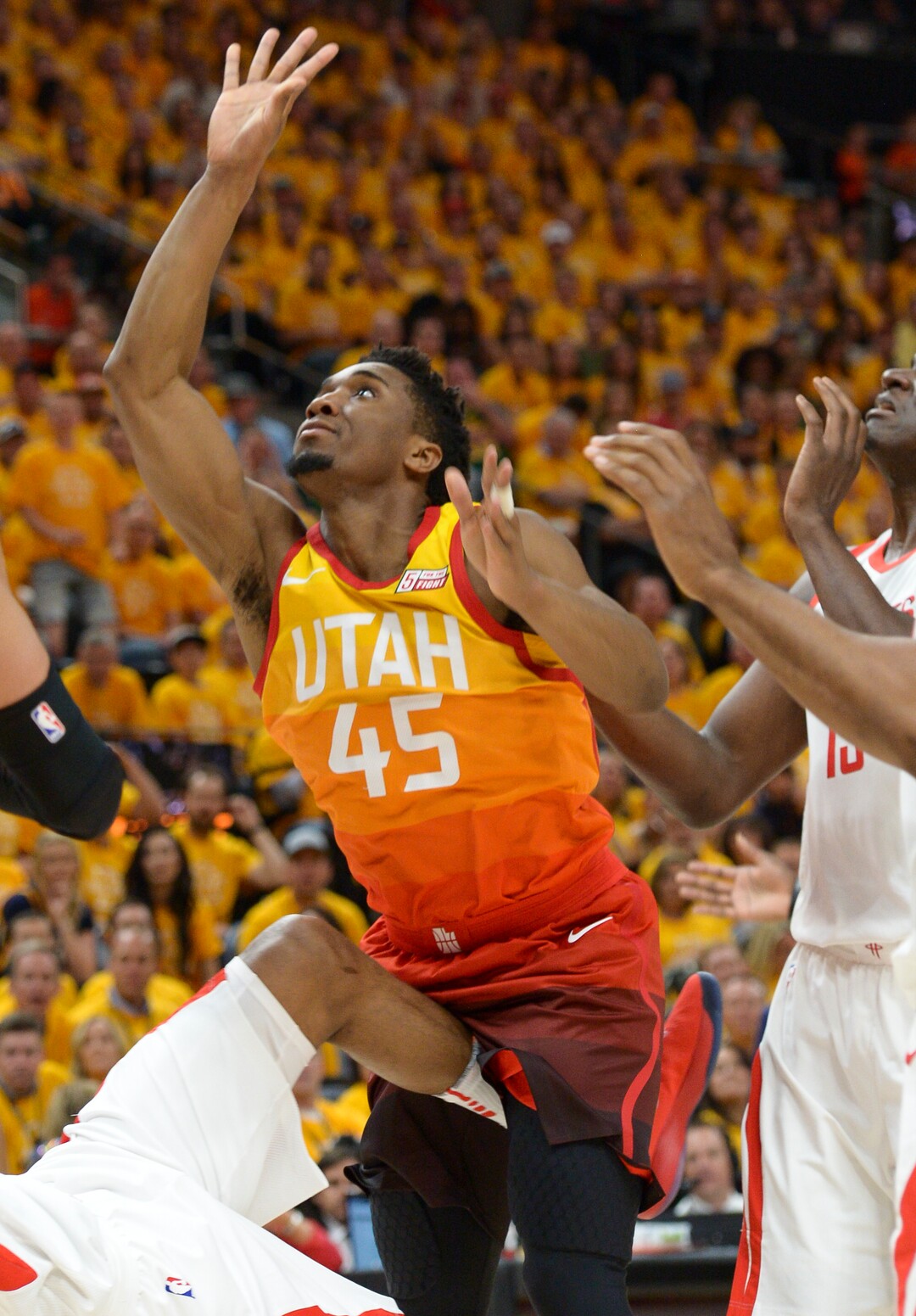 (Leah Hogsten  |  The Salt Lake Tribune) Utah Jazz guard Donovan Mitchell (45) is charged with a foul as the Utah Jazz take on the Houston Rockets in Game 3 of an NBA basketball second-round playoff series Friday, May 4, 2018 in Salt Lake City.