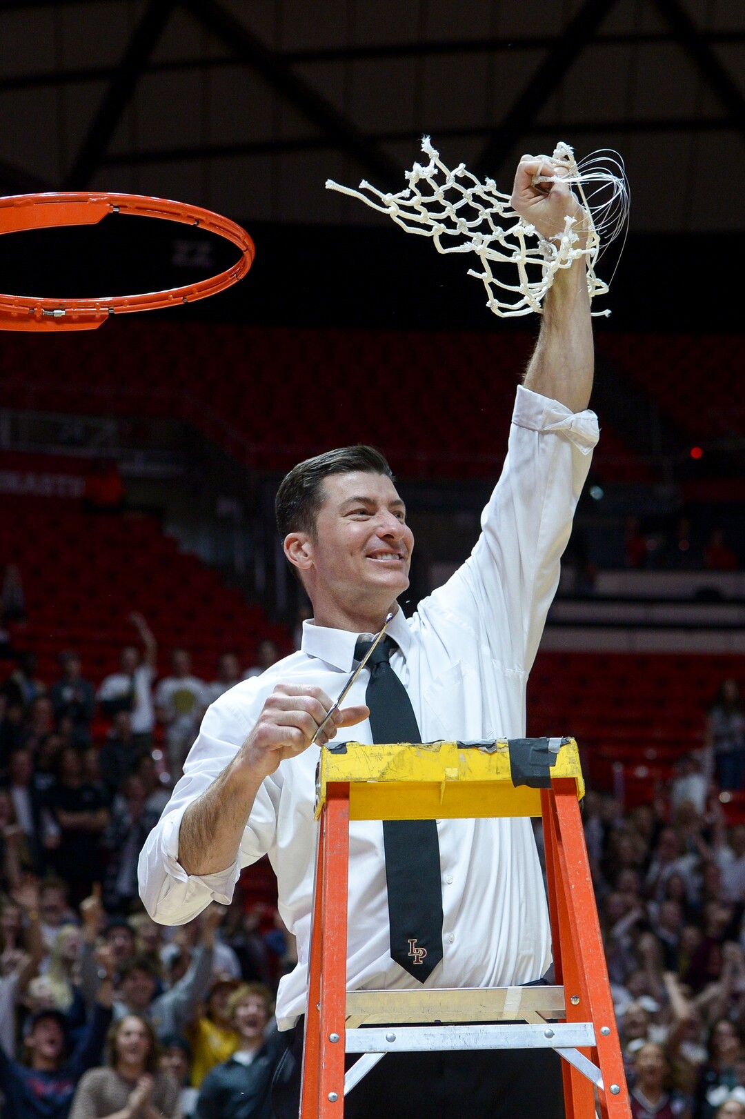 (Leah Hogsten  |  The Salt Lake Tribune) Lone Peak's head coach David Evans celebrates the championship title in his third season as the Knight's head coach. Lone Peak defeated Pleasant Grove 61-44 to win the 6A High School BoysÕ Basketball Tournament Championship at the Jon M. Huntsman Center in Salt Lake City, Saturday, March 3, 2018.