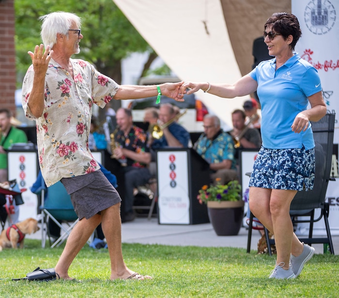 (Rick Egan | The Salt Lake Tribune)  The Sugar Sisters, Kathy Davis, Lisa Kelly Dobitz and Jo, dance to the Stratford Street Big Band, at the Heart & Soul Music Stroll, in Sugar House, on Saturday, June 10, 2023.