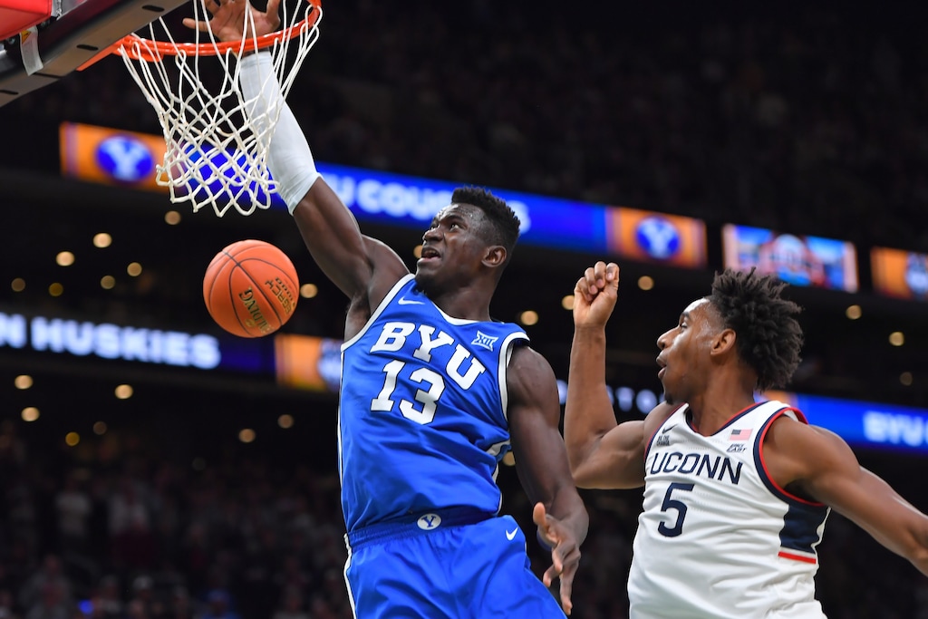 (Steven Senne | AP) BYU center Keba Keita (13) takes a shot at the basket as UConn forward Tarris Reed Jr. (5) defends Saturday, Nov. 15, 2025, in Boston.