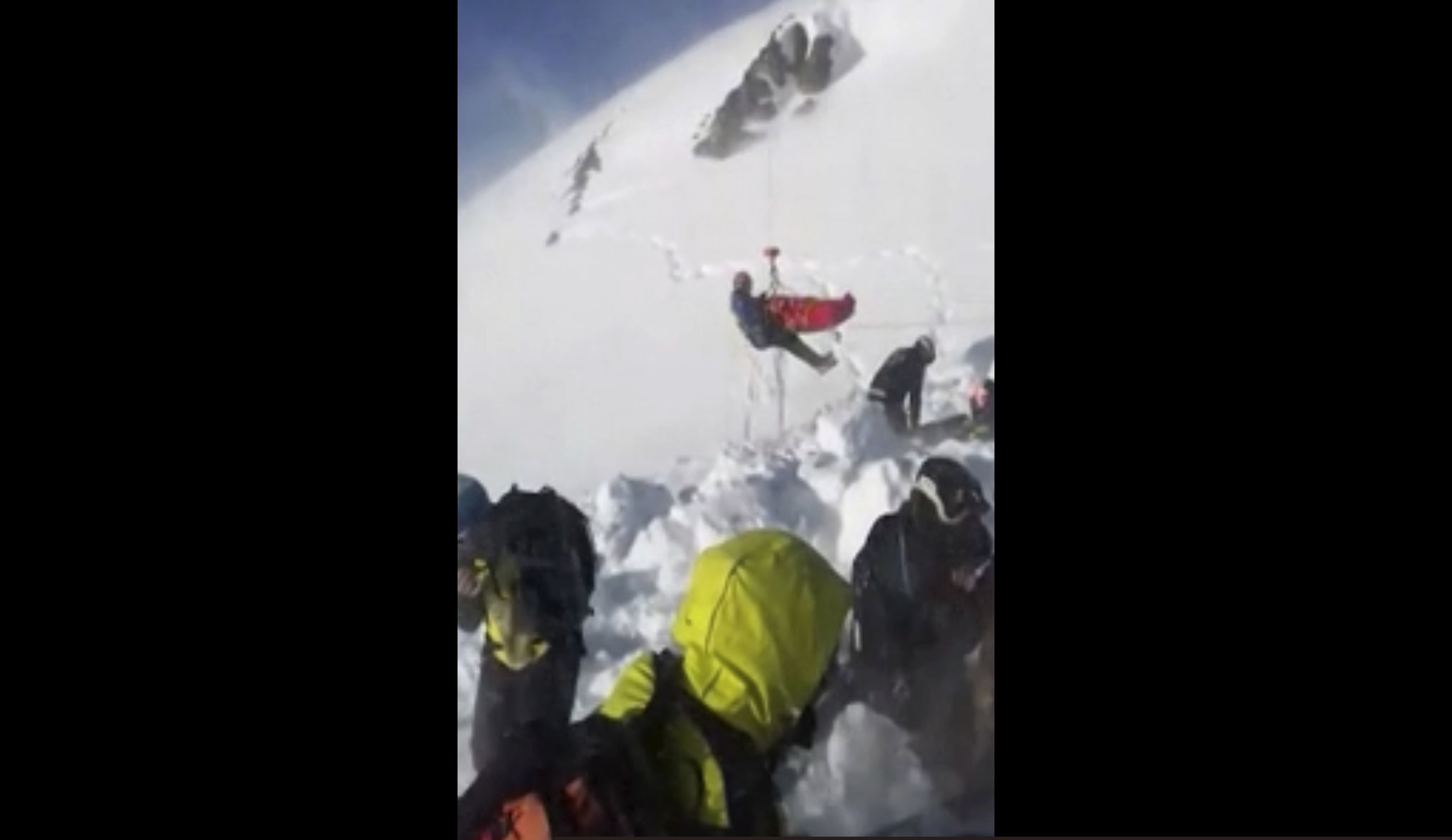 In this grab taken from validated UGC provided on Thursday, Dec. 27, 2018, a boy is airlifted after an avalanche, on the French Alps on Wednesday. A 12-year-old boy in the French Alps was found alive and uninjured after being buried under an avalanche for 40 minutes, an event his rescuers are calling a true "miracle." (UGC via AP)