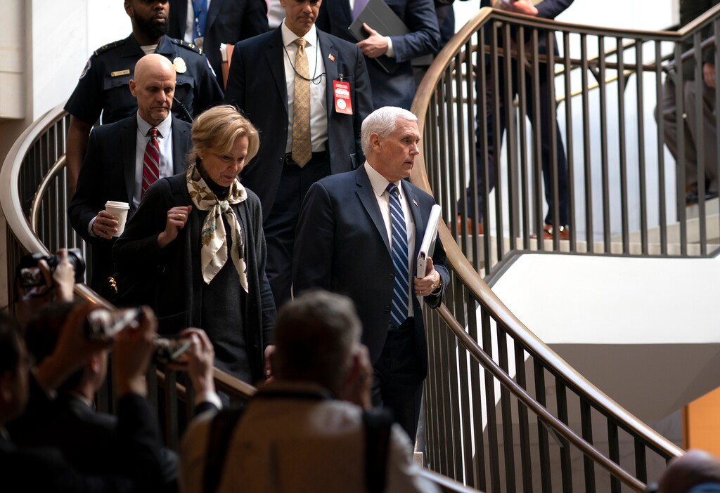 (J. Scott Applewhite | The Associated Press) Vice President Mike Pence, center, joined at left by Dr. Deborah Birx, the coronavirus response coordinator, arrives at the Capitol to brief House members on the COVID-19 outbreak, in Washington, Wednesday, March 4, 2020. Congressional negotiators have reached agreement on an $8.3 billion bill to fund the government's response to the public health emergency.