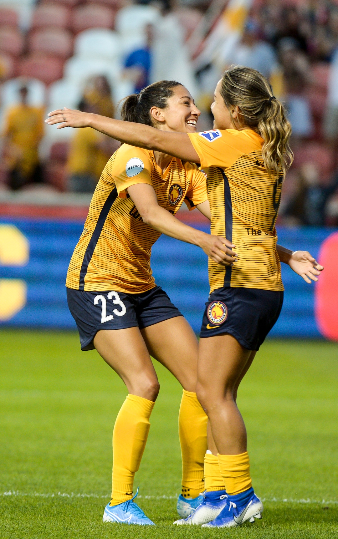(Leah Hogsten  |  The Salt Lake Tribune) Utah Royals FC forward Christen Press (23) and Utah Royals FC midfielder Lo'eau LaBonta (9) celebrate Press’ second goal as the Utah Royals FC host Sky Blue FC, August 7, 2019 at Rio Tinto Stadium.