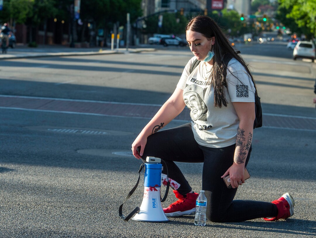 (Rick Egan  |  The Salt Lake Tribune)    Sofia Alcala kneels with protesters on State Street, as they take a moment of silence for Bearnardo Palacios, during a Justice for Bernardo demonstration, in Salt Lake City, Tuesday, July 7, 2020.