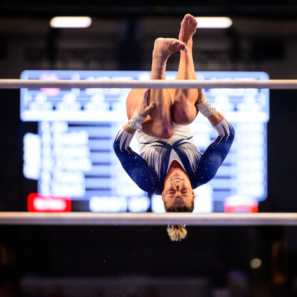 (Trent Nelson  |  The Salt Lake Tribune) Utah State's Leighton Varnadore on the bars at the Best of Utah NCAA Gymnastics Meet in West Valley City on Saturday, Jan. 11, 2020.