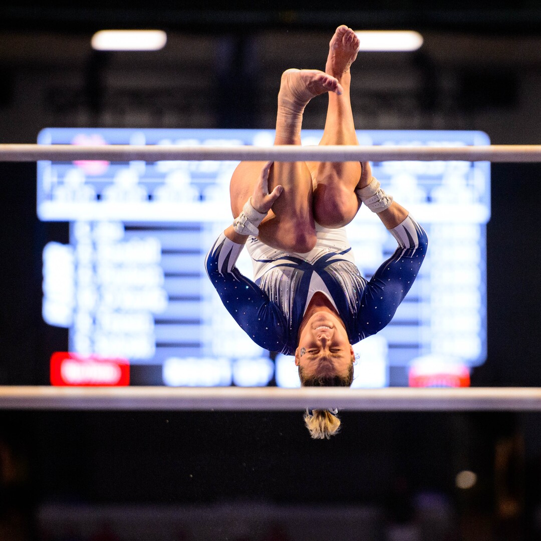 (Trent Nelson  |  The Salt Lake Tribune) Utah State's Leighton Varnadore on the bars at the Best of Utah NCAA Gymnastics Meet in West Valley City on Saturday, Jan. 11, 2020.