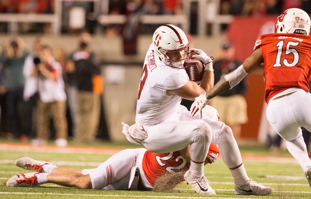 (Rick Egan  |  The Salt Lake Tribune)Stanford Cardinal tight end Dalton Schultz (9) is stopped by Utah Utes defensive back Chase Hansen (22) and Utah defensive back Corrion Ballard, in PAC-12 football action, Utah Utes vs. Stanford Cardinals, at Rice-Eccles Stadium, Saturday, October 7, 2017.