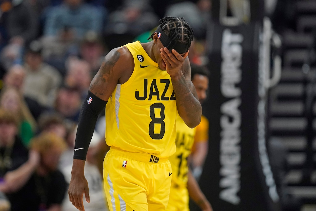 Utah Jazz forward Jarred Vanderbilt (8) holds his head as he walks up court during the second half of an NBA basketball game against the Atlanta Hawks Friday, Feb. 3, 2023, in Salt Lake City. (AP Photo/Rick Bowmer)