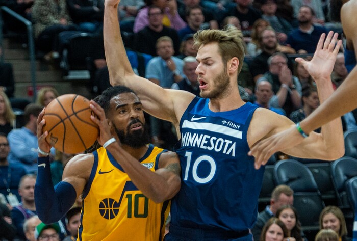 (Rick Egan  |  The Salt Lake Tribune)     Utah Jazz guard Mike Conley (10) looks for a shot as Minnesota Timberwolves forward Jake Layman (10) defends, in NBA action between the Utah Jazz and the Minnesota Timberwolves in Salt Lake City, Monday, Nov. 18, 2019.