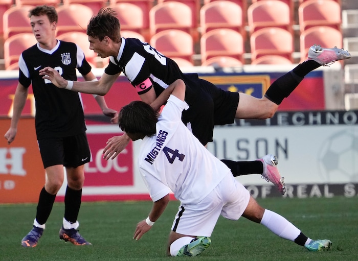 (Francisco Kjolseth | The Salt Lake Tribune) Davis’s Elliott Pehrson (23) collides with Herriman's Jason R. Dunham (4) during their 6A State Soccer Championship title game at Rio Tinto Stadium, Wednesday, May 25, 2022. Herriman defeated Davis 1-0 with two seconds left on the clock.