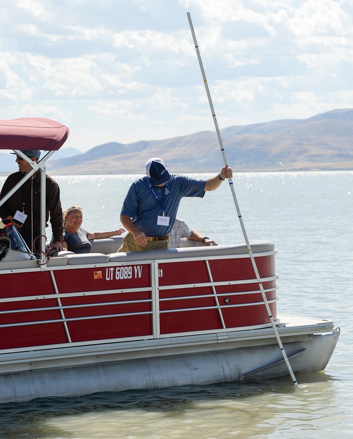 (Francisco Kjolseth | The Salt Lake Tribune) Chris Tschirki of the Wasatch Front Water Quality Council checks the shallow depth of Utah Lake during a tour. Members of the Legislative Water Development Commission gathered before a tour of Utah Lake on Wednesday, Sept. 13, 2017, for the purpose of learning of wastewater treatment, the importance of protecting our lakes and rivers, how the state is looking to change water quality standards and how regulation is an important local issue.