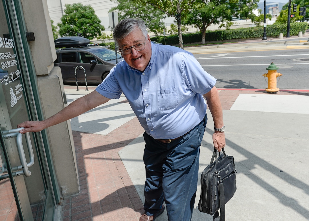 (Francisco Kjolseth  |  The Salt Lake Tribune)  Salt Lake Tribune writer Lee Davidson finishes his race against colleagues after using TRAX in a transportation race from Library Square to the Tribune building at the Gateway on Thursday, Aug. 2, 2018. Modes of transportation included, rentable electric scooters, Green Bike, TRAX, Lyft, and walking.