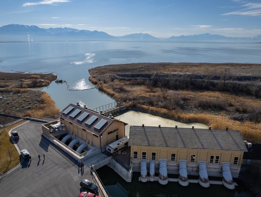 (Francisco Kjolseth | The Salt Lake Tribune) The historic Utah Lake Pump Station, at right, replaced in 2013 after over 100 years of service, is kept for historical preservation alongside the new pump station designed to transfer water to the Jordan River using four 200 cubic feet per second vertical propeller pumps. The unique siphon discharge technology from the original design, was preserved, pictured on Friday, March 18, 2022. 