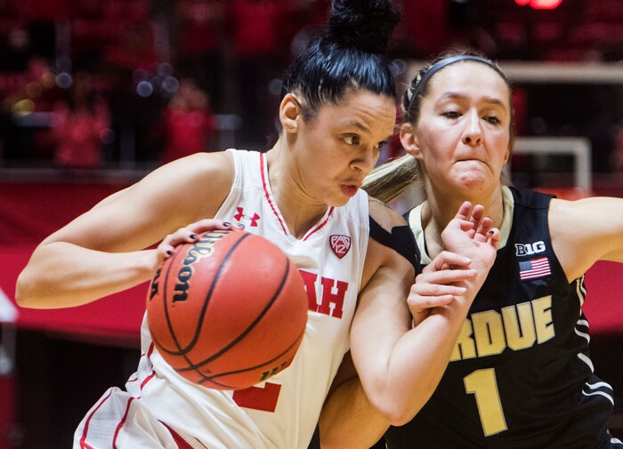 (Rick Egan  |  The Salt Lake Tribune)  Utah Utes guard Tori Williams (2) drives inside with the ball, as Purdue Boilermakers guard Karissa McLaughlin (1) defends, in basketball action Utah Utes vs. Purdue Boilermakers, at the Jon M. Huntsman Center, Monday, Nov. 20, 2017.