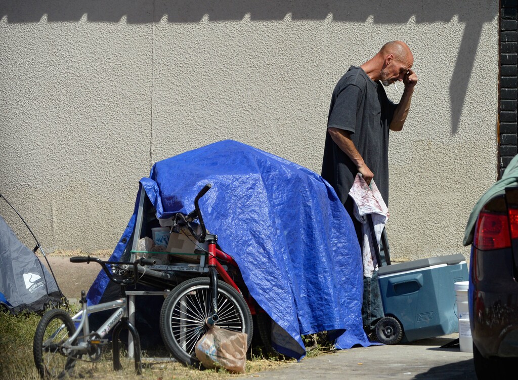 (Francisco Kjolseth  |  Tribune file photo) Homeless individuals camp out on the streets of downtown Salt Lake City, Aug. 12, 2020. Homeless service providers throughout Utah have seen a spike in demands, including the number of people in need of emergency shelter and other resources.
