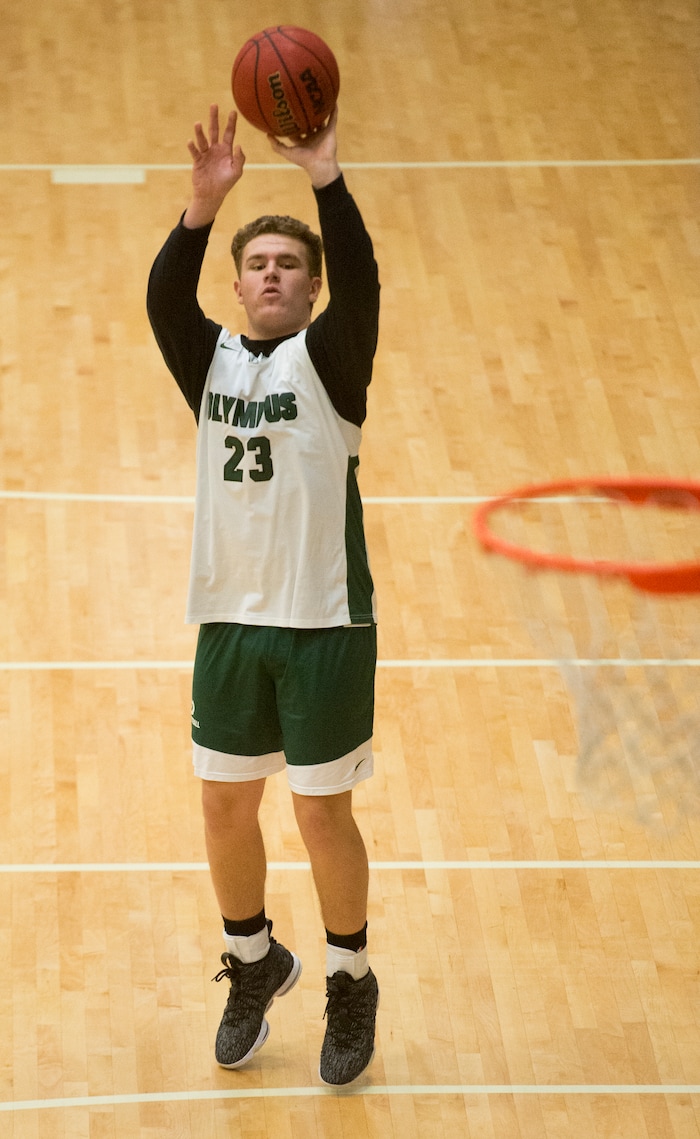(Rick Egan  |  The Salt Lake Tribune)    Harrison Creer (23), one of Olympus boys' basketball team's two big men runs drills during basketball practice, Monday, January 8, 2018.