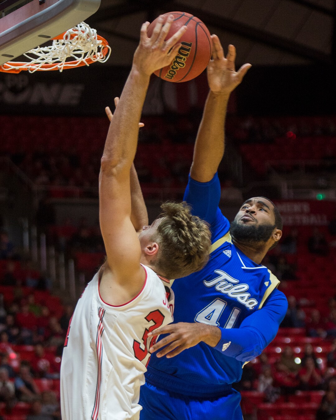 (Rick Egan  |  The Salt Lake Tribune)   Tulsa Golden Hurricane forward Jeriah Horne (41) blocks a sho by Utah Utes center Jayce Johnson (34), in basketball action between, Utah Utes and Tulsa Golden Hurricane, at the Jon M. Huntsman Center, Saturday, Dec. 1, 2018.