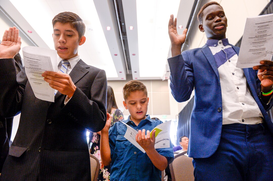 Leah Hogsten  |  The Salt Lake Tribune  With hands on their heart 21 participants, ages 5 to 22, representing 8 countries, spoke the oath of citizenship as America's newest citizens during a youth naturalization ceremony at the Viridian Event Center in West Jordan, Monday, August 6, 2018. 