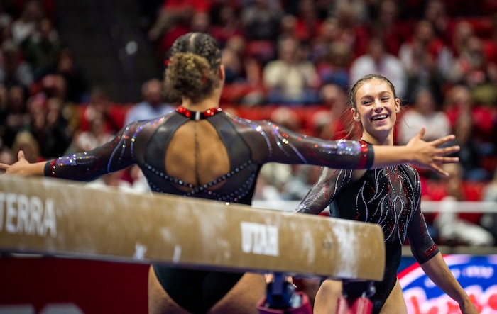 (Rick Egan | The Salt Lake Tribune)  Grace McCallum smiles after landing her dismount on the beam, in gymnastics action between Utah Red Rocks and Oregon State, at the Jon M. Huntsman Center, on Friday, Feb. 2, 2024.