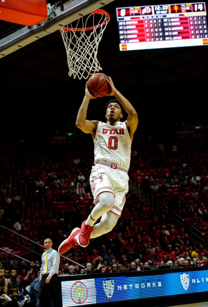 (Steve Griffin  |  The Salt Lake Tribune) Utah Utes guard Sedrick Barefield (0) soars to the rim for a dunk during the Utah Utes versus Arizona State Sound Devils at the Huntsman Center on the University of Utah campus in Salt Lake City Sunday January 7, 2018.