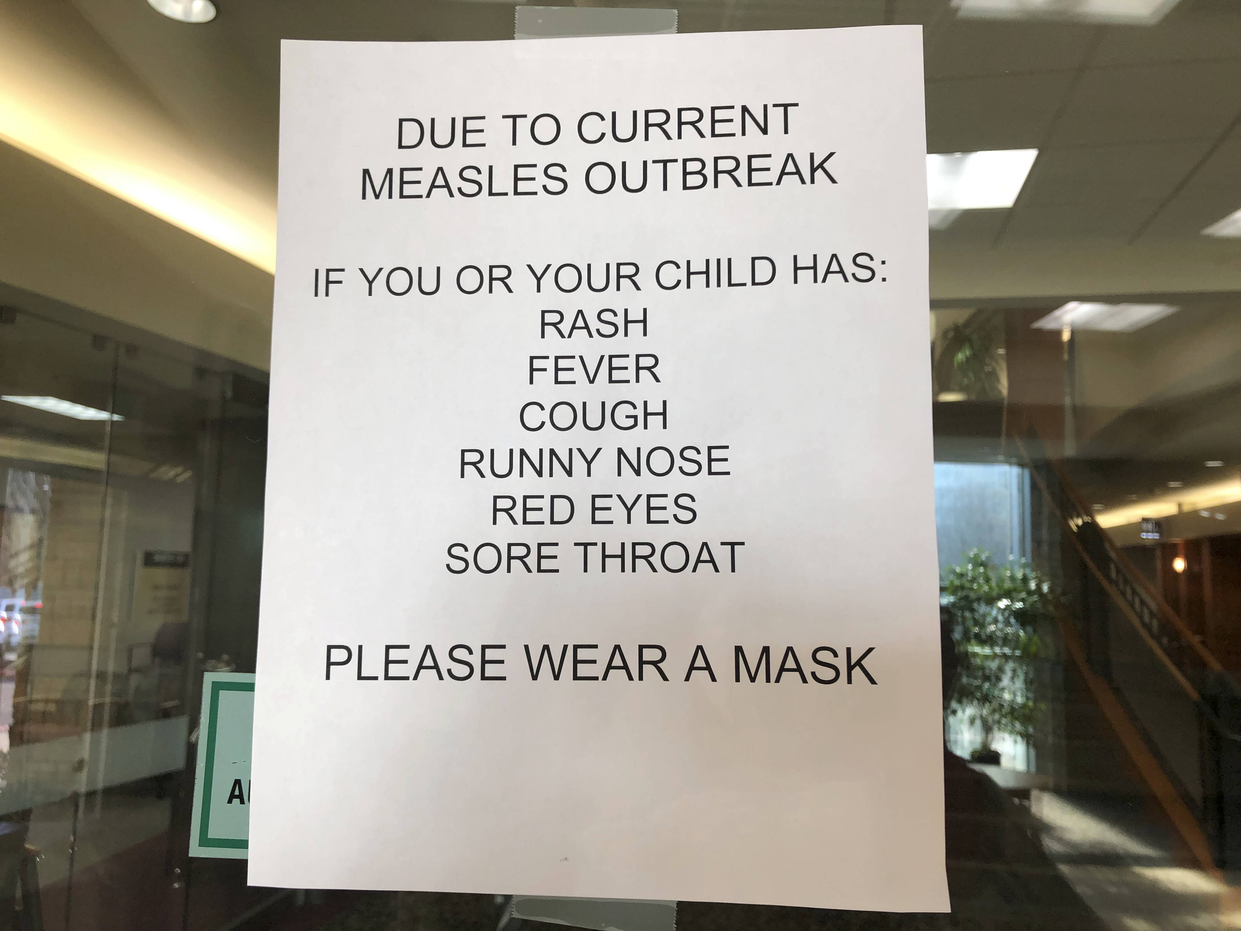 (Gillian Flaccus | Associated Press photo) Signs posted at The Vancouver Clinic in Vancouver, Wash., warn patients and visitors of a measles outbreak on Wednesday, Jan. 30, 2019. The outbreak has sickened 39 people in the Pacific Northwest, with 13 more cases suspected. At least one patient who was sick with the measles has come to this clinic for treatment since the outbreak began Jan. 1, 2019.