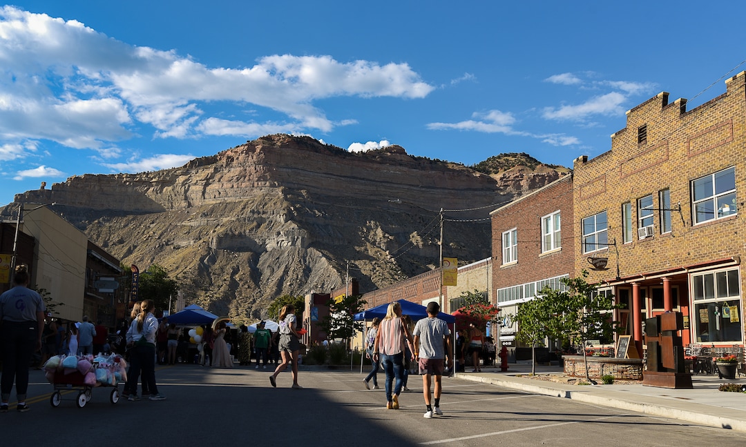 (Francisco Kjolseth  |  The Salt Lake Tribune)  Helper First Fridays draws people to historic Main Street on Friday, Aug. 2, 2019, for their monthly gallery stroll where the small town has been discovered by a variety of artists and dreamers seeking to escape the hustle of the Wasatch Front, lured by cheap real estate prices. Helper today resembles Park City in the late 1960s. Some aging, empty buildings remain, but newcomers joining natives are slowly reinventing the little town of just over 2,000 residents as an artist colony and tourist destination.