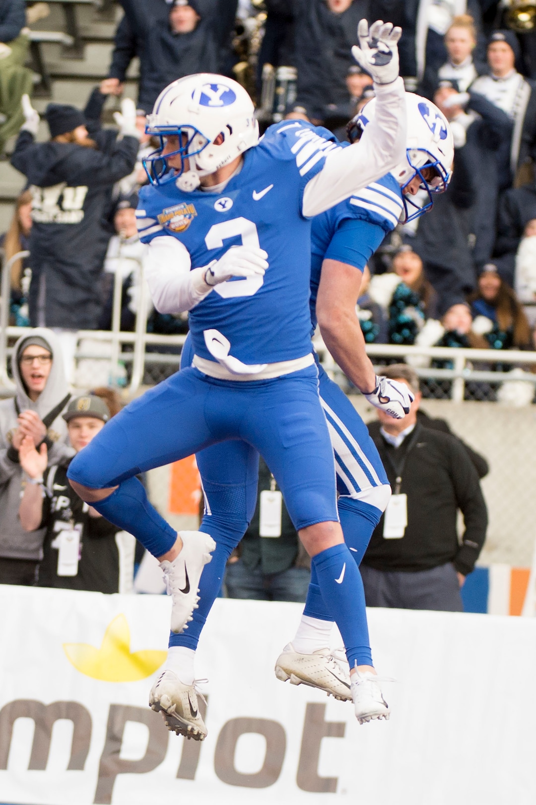 (Jeremy Harmon  |  The Salt Lake Tribune) Brigham Young Cougars defensive back Keenan Ellis (30) celebrates with teammate Brigham Young Cougars wide receiver Talon Shumway (21) after scoring the first touchdown of the game as BYU faces the Western Michigan Broncos in the Famous Idaho Potato Bowl in Boise, Idaho, on Friday, Dec. 21, 2018.