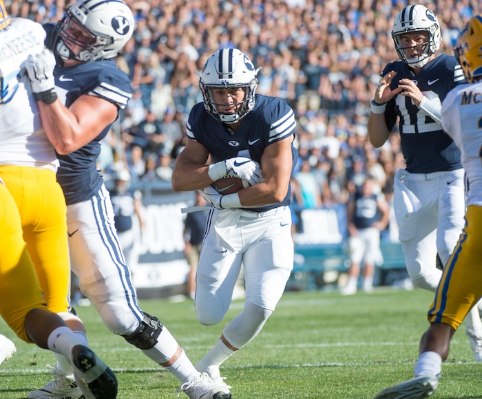 (Rick Egan  |  The Salt Lake Tribune)    Brigham Young Cougars running back Lopini Katoa (4) scores his first of two second quarter touchdowns, in football action Brigham Young Cougars vs McNeese State Cowboys at Lavell Edwards Stadium, Saturday, Sept. 22, 2018.



