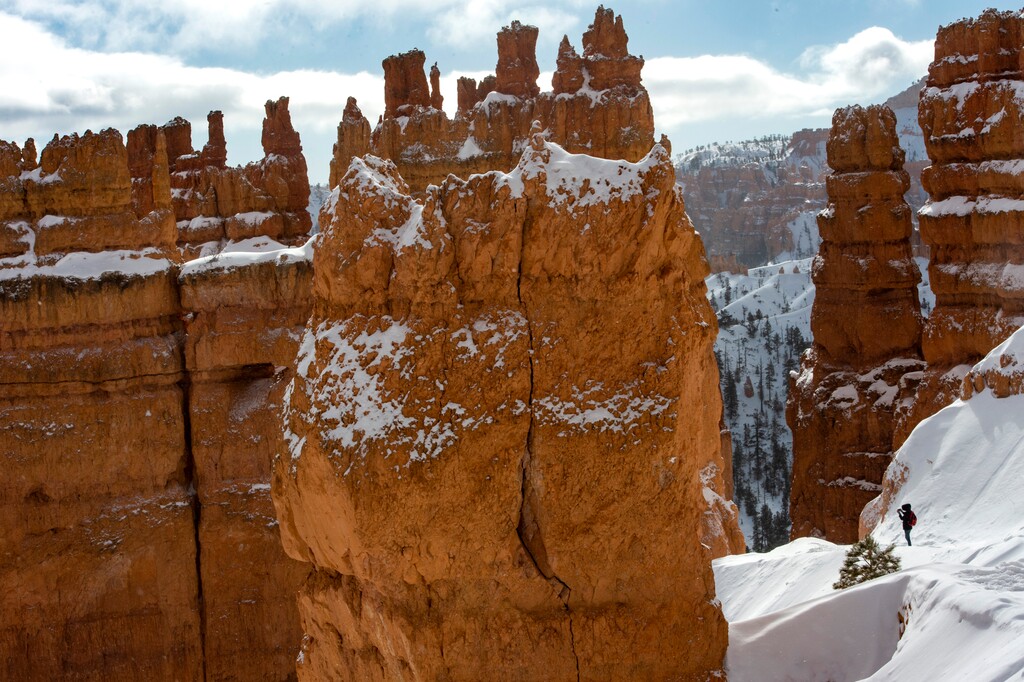 (Rick Egan | The Salt Lake Tribune) A hiker stops to take a photo in Bryce Canyon, on Sunday, Feb. 14, 2021.   