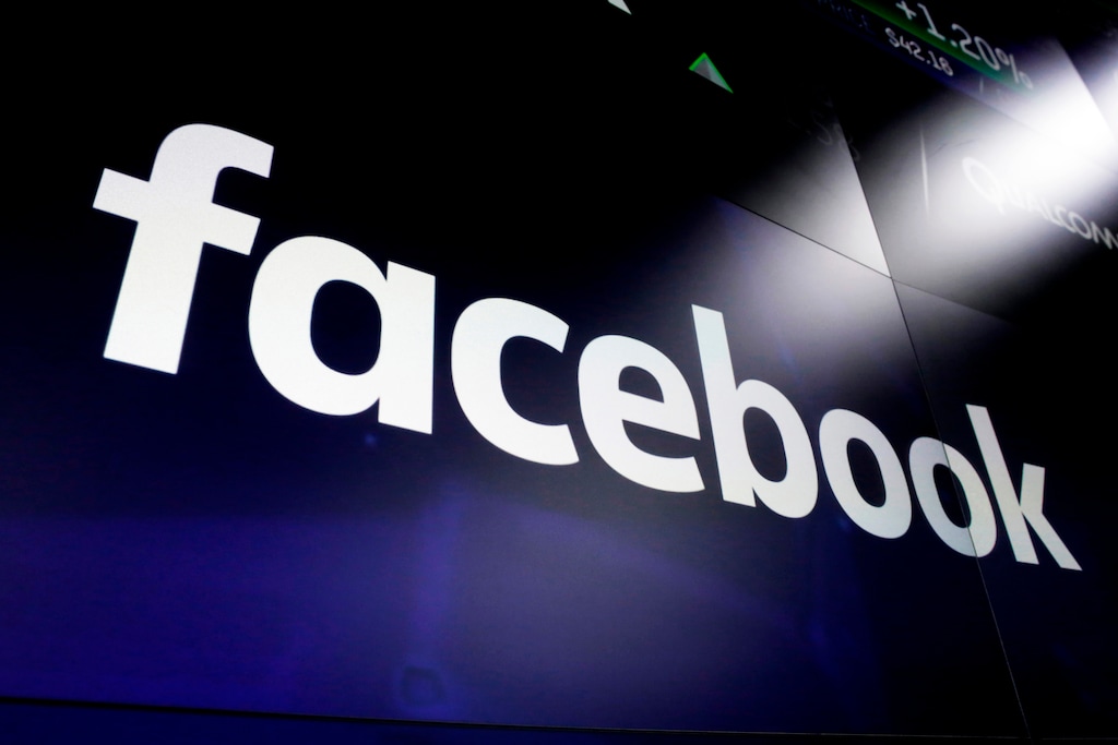 (Richard Drew | The Associated Press) This March 29, 2018, photo shows the Facebook logo on screens at the Nasdaq MarketSite, in New York's Times Square. A federal court threw out the Federal Trade Commission’s antitrust complaint against Facebook on Monday.