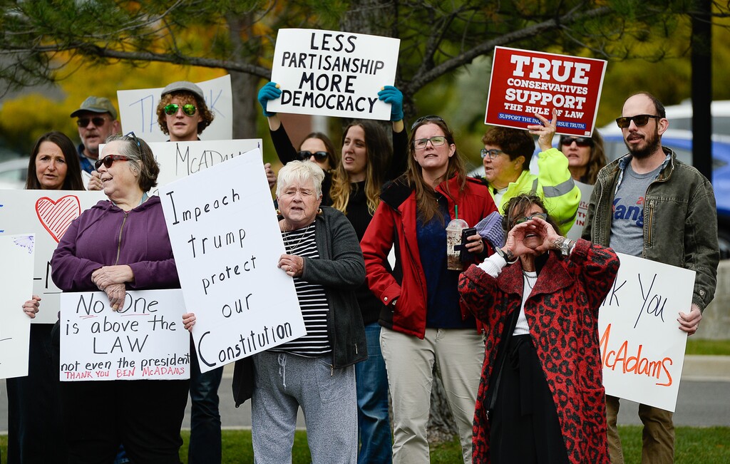 (Francisco Kjolseth | The Salt Lake Tribune) "This is what democracy looks like," shout supporters of the impeachment inquiry as two competing rallies spar near Rep. Ben McAdams' office in West Jordan, one seeking to support McAdams and one to criticize him for supporting the impeachment inquiry of President Donald Trump on Wednesday, Oct. 9, 2019.